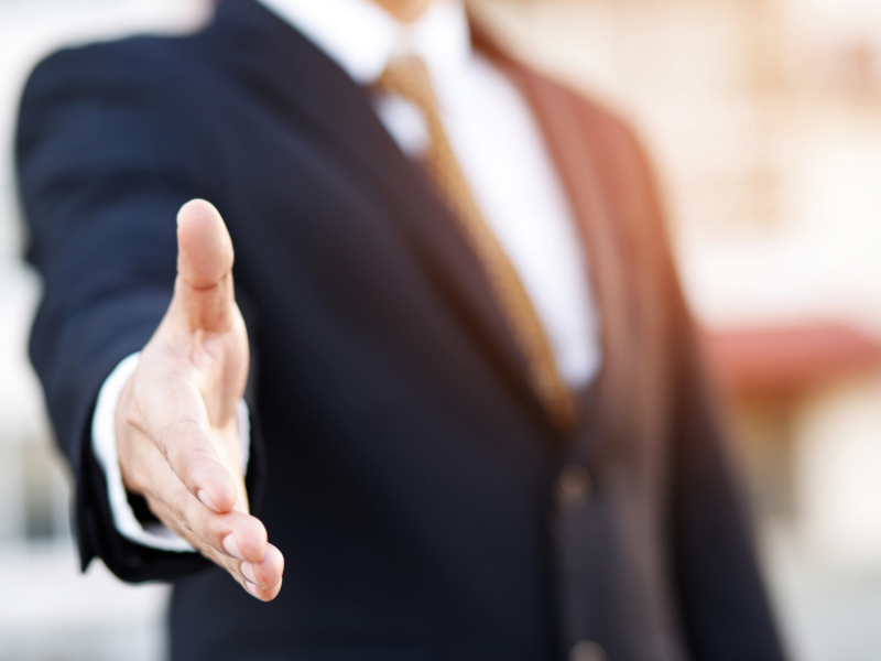 Person reaching for handshake