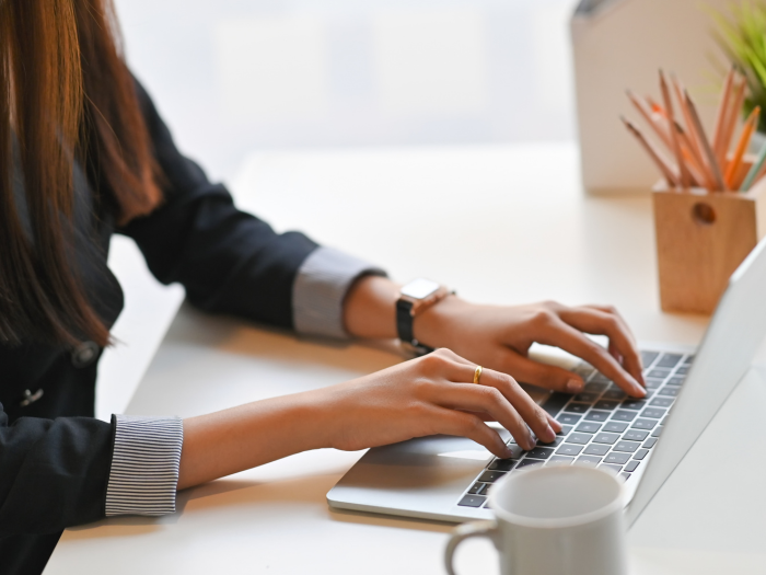 Woman typing on computer