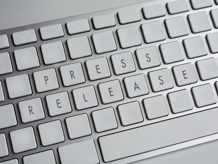 Computer keyboard spelled out with press release