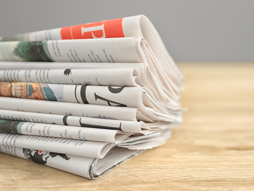 Stack of newspapers media coverage