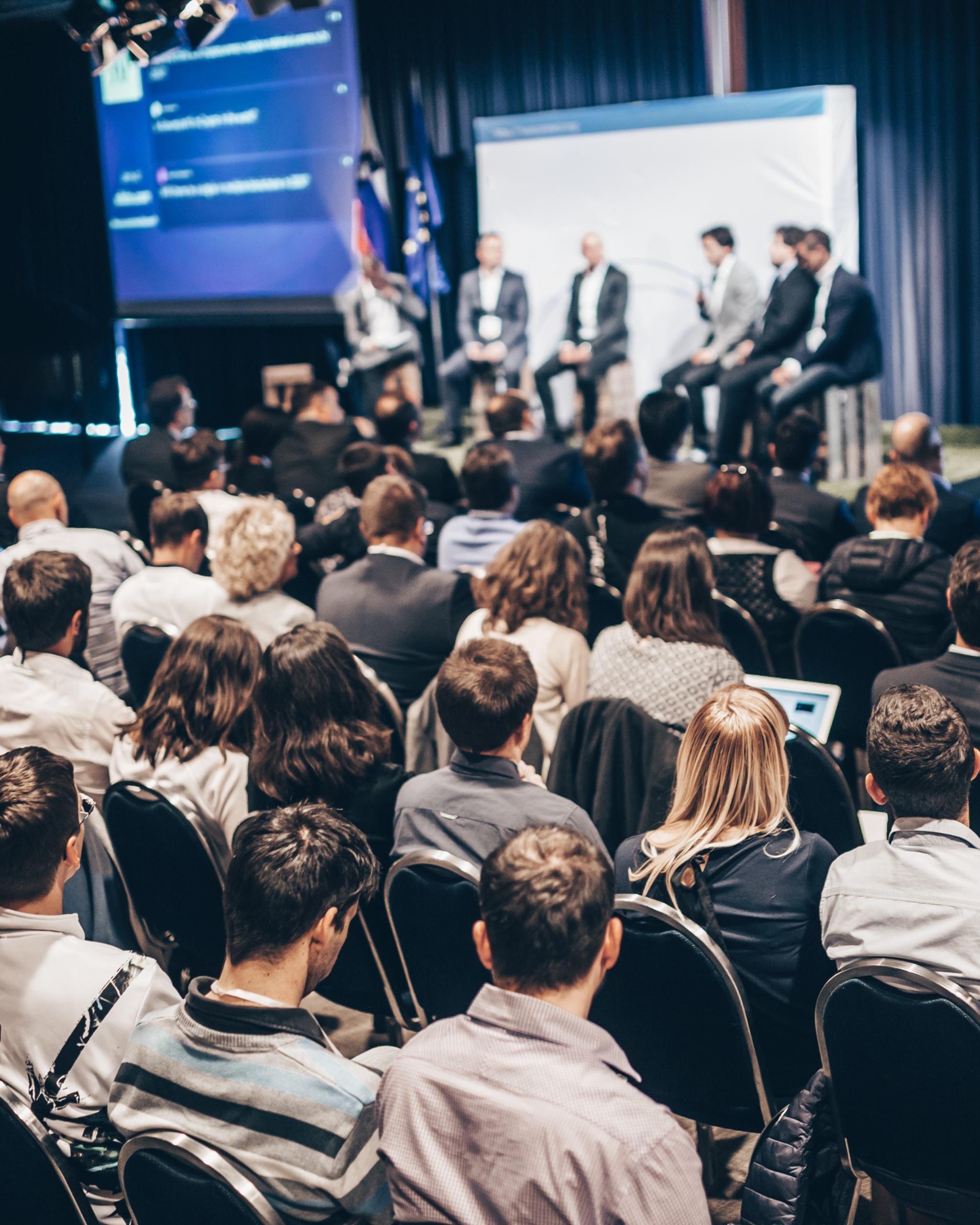 Panelists Speaking at a Conference